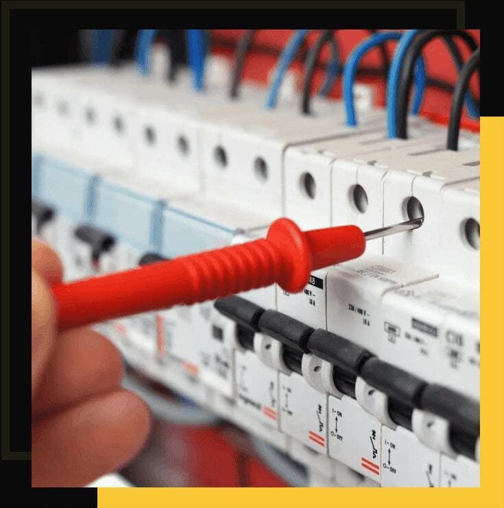 A person is working on an electrical panel.